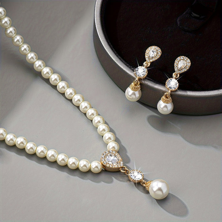 Vintage classic pearl jewellery set laid flat on a white background