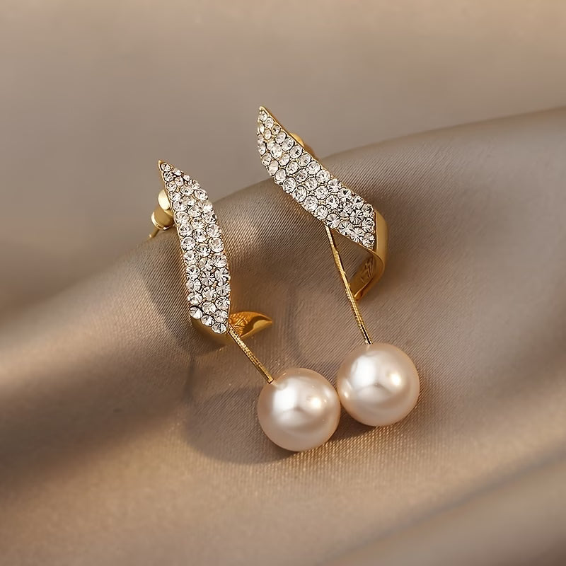 Close-up of the crystal detailing along the plume earring design