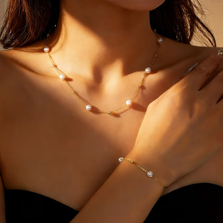 Model wearing the dainty pearl chain jewellery set