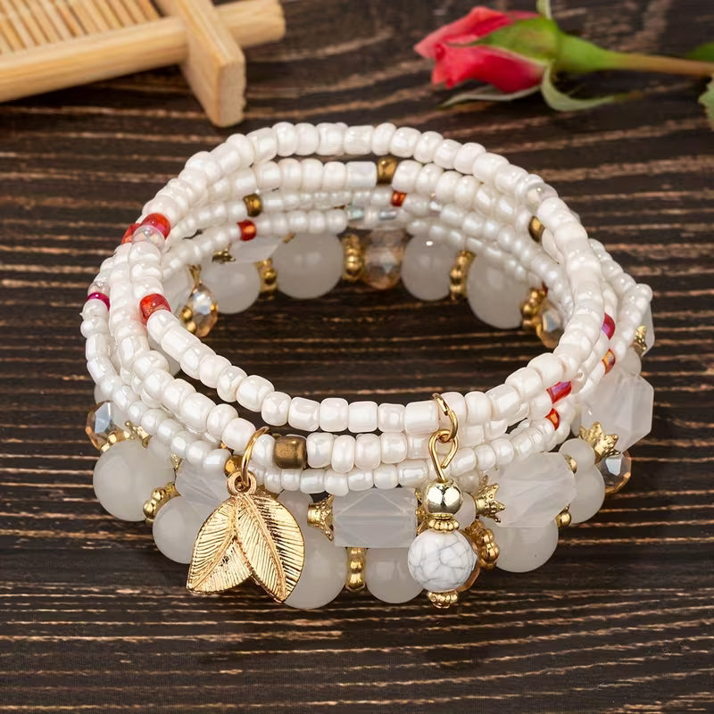 Main shot of the crown pearl charm bracelet set