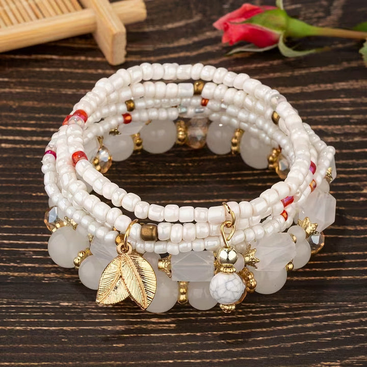 Main shot of the crown pearl charm bracelet set
