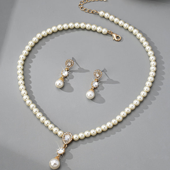 Matching pearl earrings shown beside the necklace