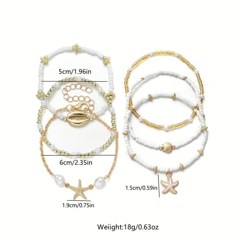 Coastal gold and pearl bracelet set displayed on a white background