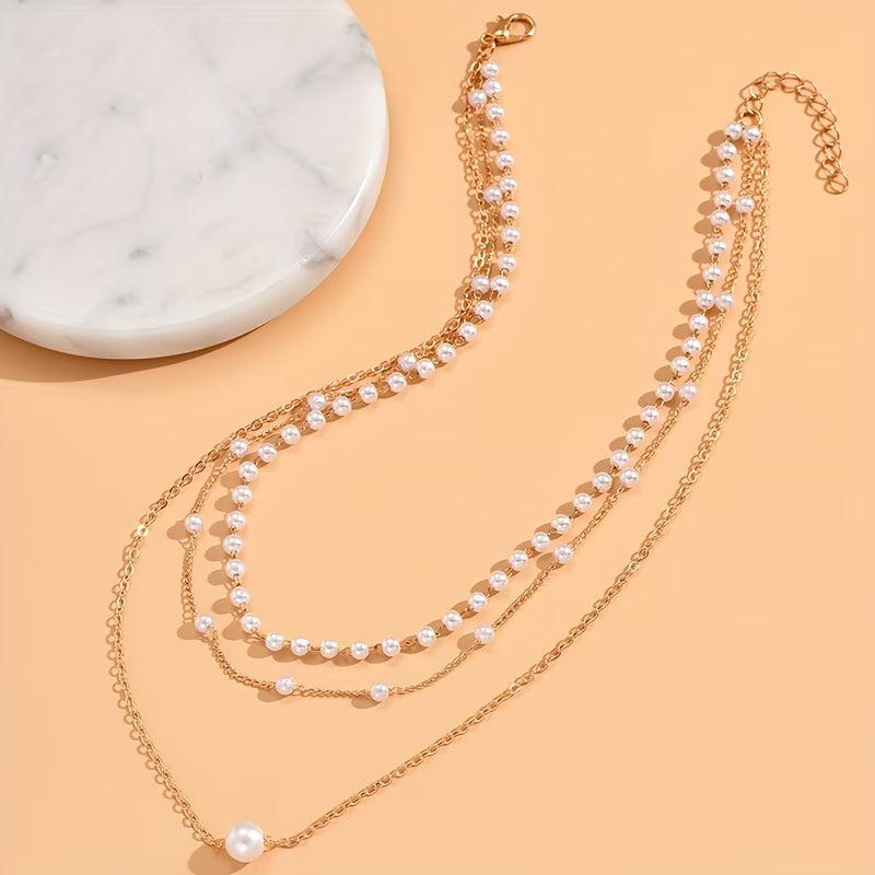 Close-up of the pearl detailing along each chain