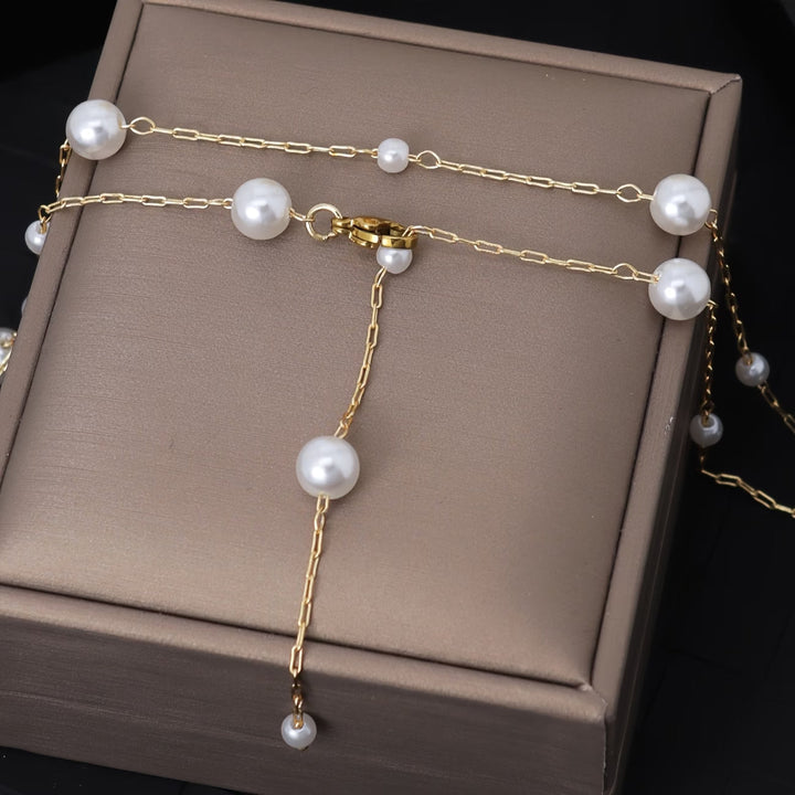 Elegant sky pearl necklace styled on a mannequin neck form