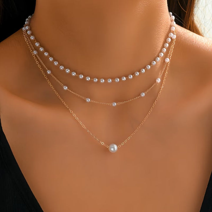 Trinity pearl necklace set with three layered chains