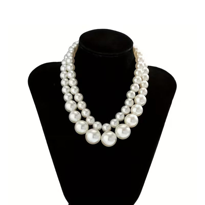 Side view highlighting the necklace's statement volume