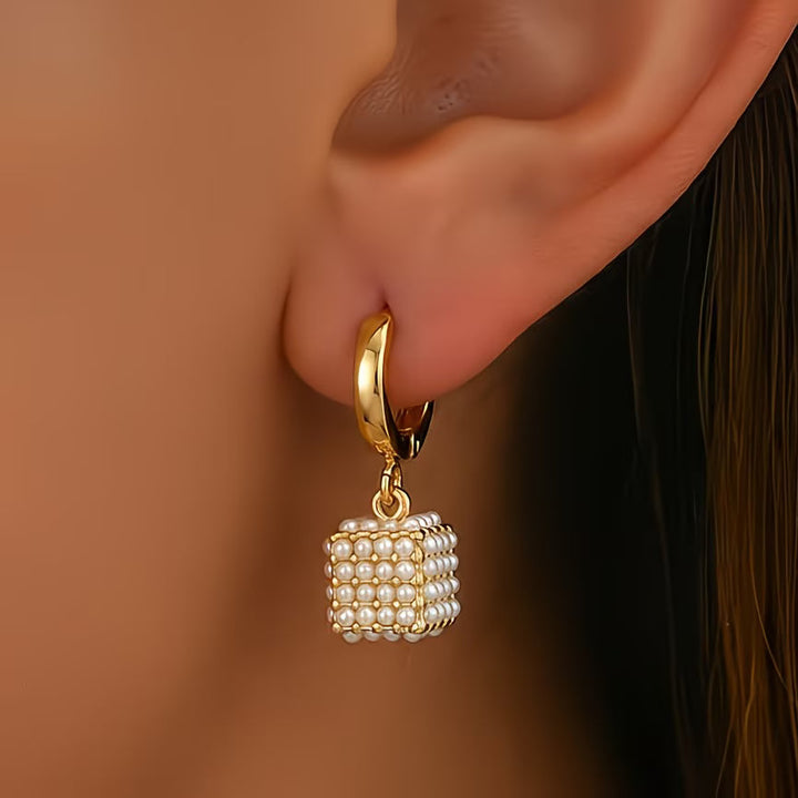 Pearl cube earrings shown as the main product photo