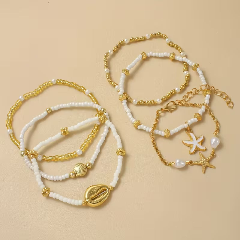 Individual gold-tone charm bracelet from the coastal set