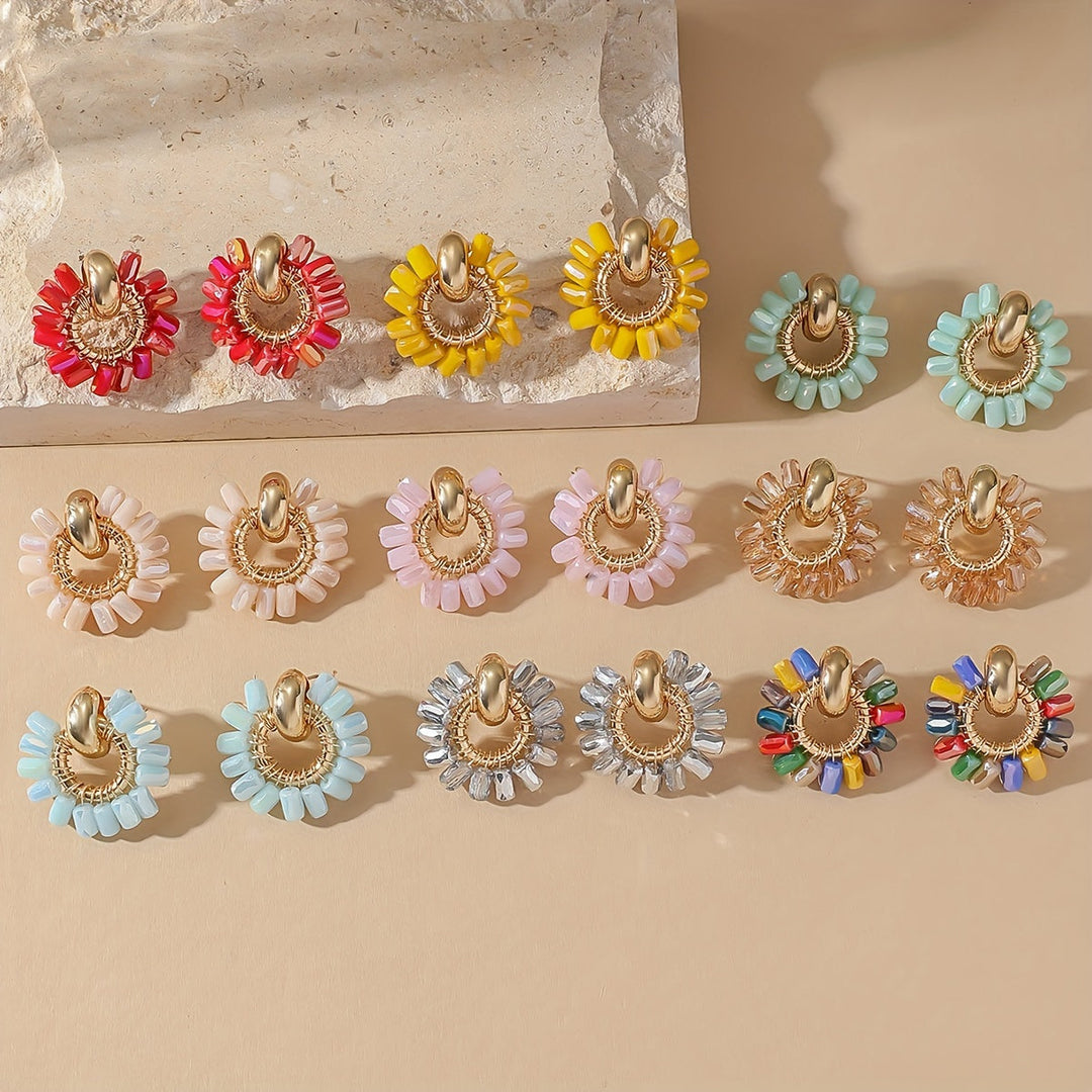 Fan earrings worn in the ear to show the shape