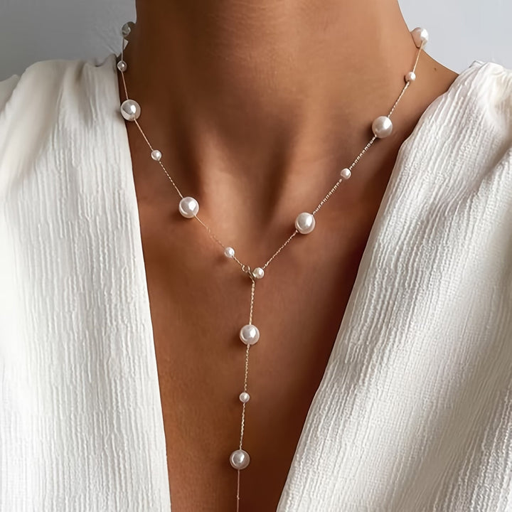 Elegant sky pearl necklace laid flat on a plain background