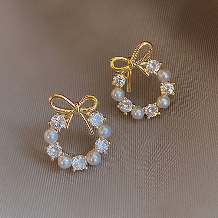 Main shot of the pearl bow drop earrings