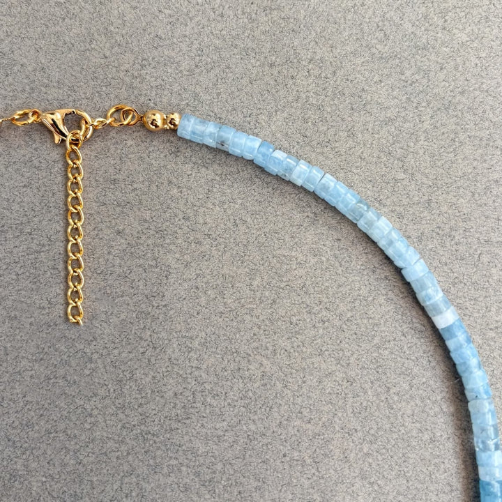 Necklace draped over a jewellery bust to show drape and length