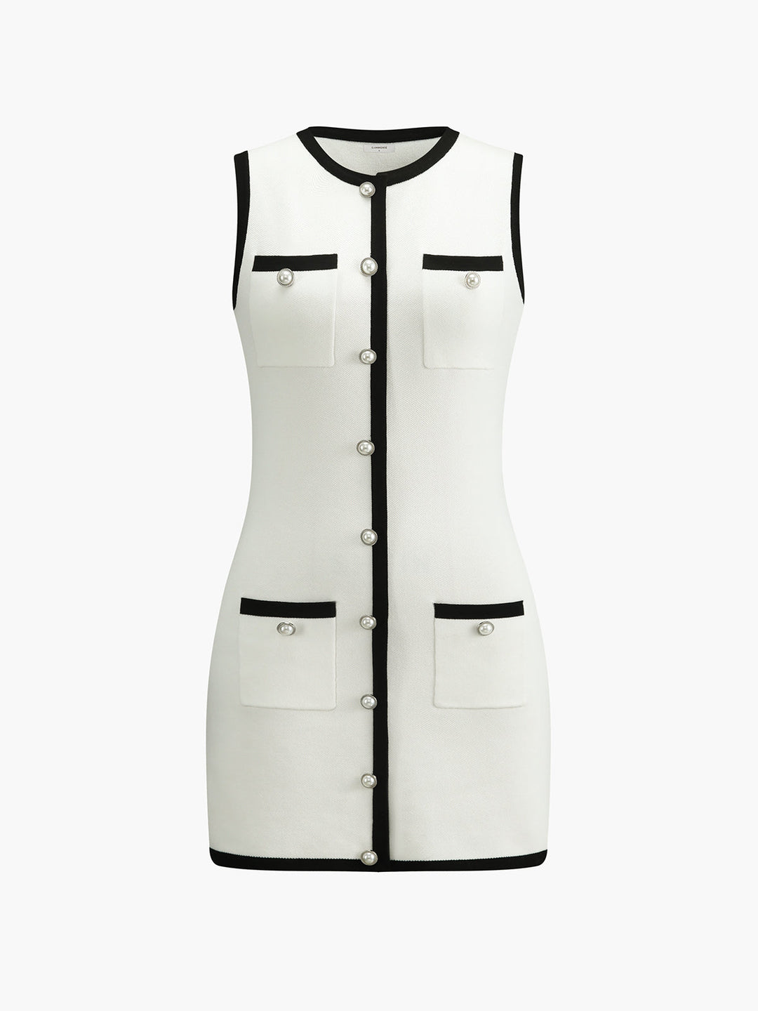 Front view of the white colourway with black contrast trim, pearl buttons and patch pockets