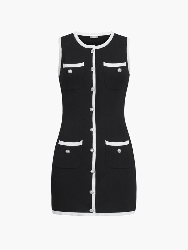 Front product view of the black multi pocket sleeveless sweater dress with white piping