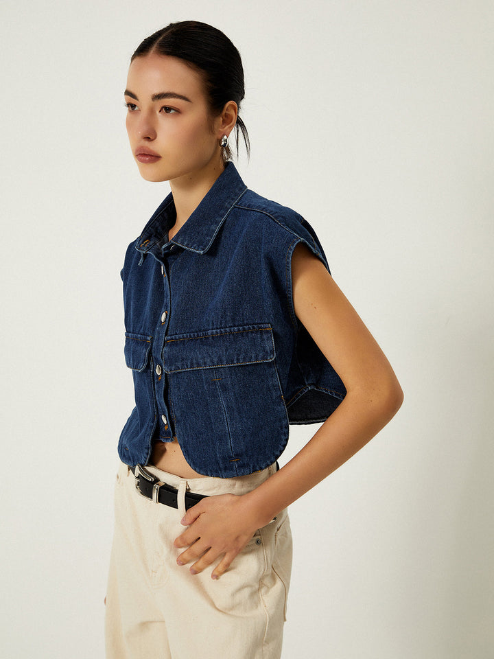 Three-quarter turn in sleeveless denim vest with extended cap shoulder seams