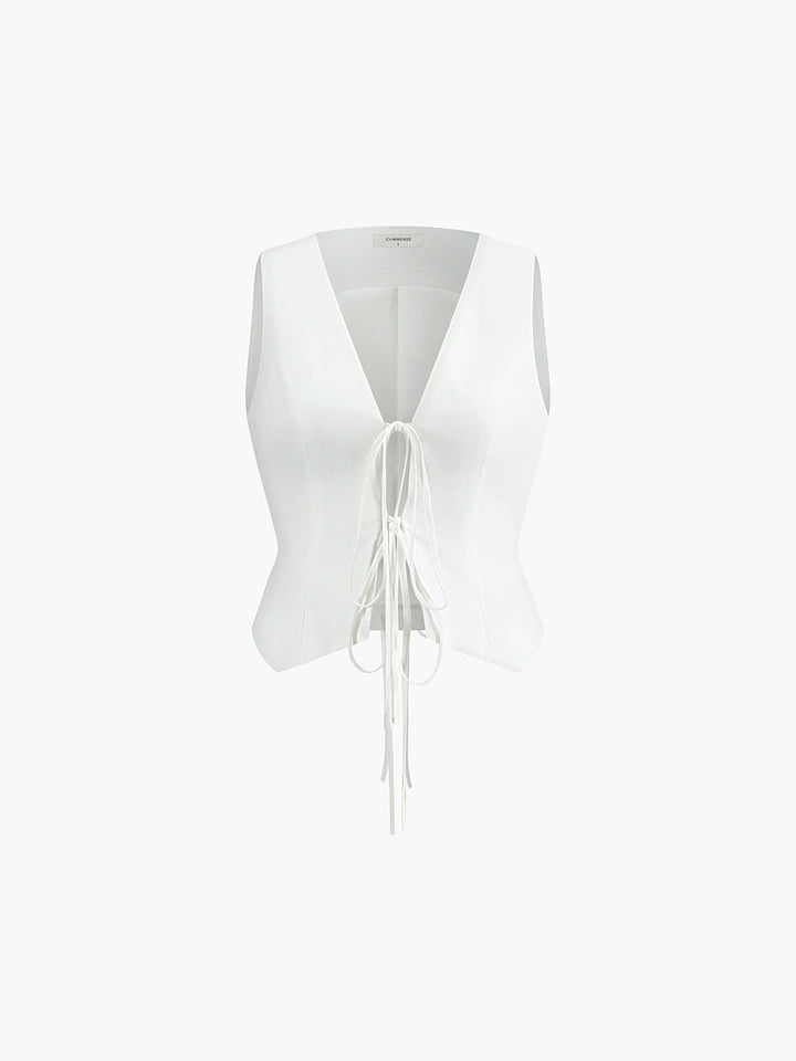 White cotton linen tie detail vest shown flat from the front with long self-tie ribbons