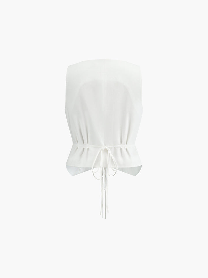 White sleeveless vest back view with elasticated gathered peplum waist