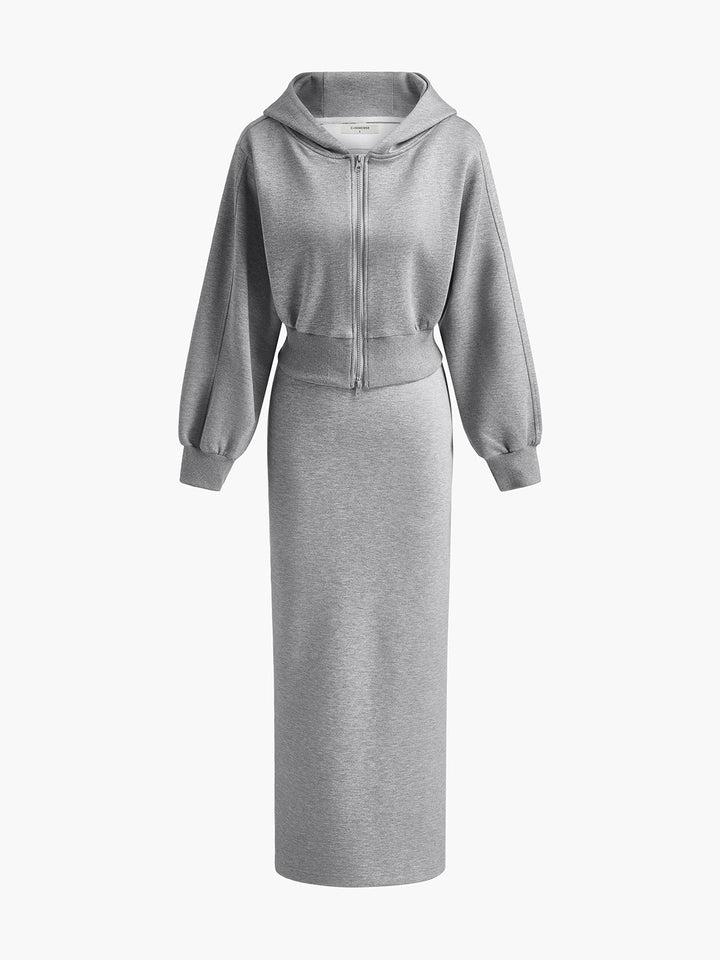 Product shot of the grey hoodie styled over a matching long sweat skirt