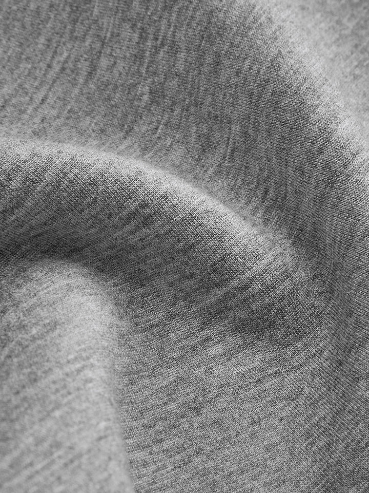 Close-up of the soft brushed grey marl fleece fabric