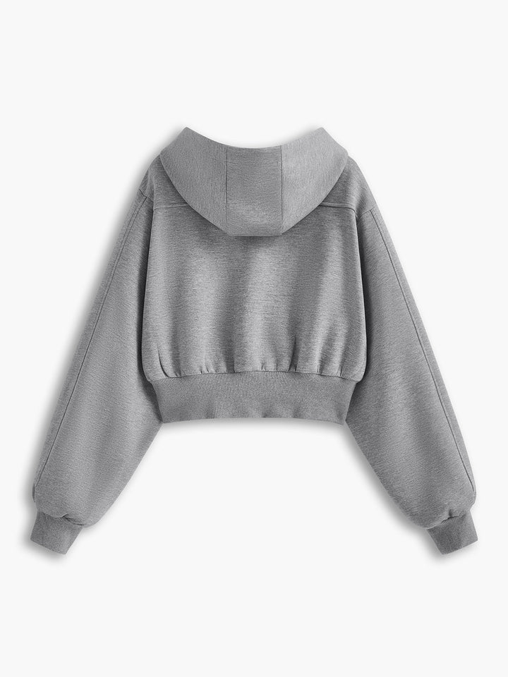 Back view of the short grey hoodie showing the panelled hood
