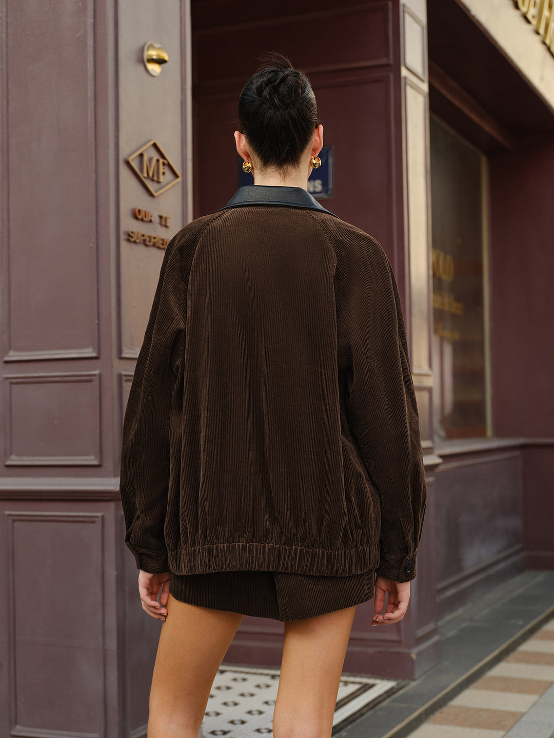 Back of the oversized corduroy jacket showing elasticated hem and wide ribbed texture