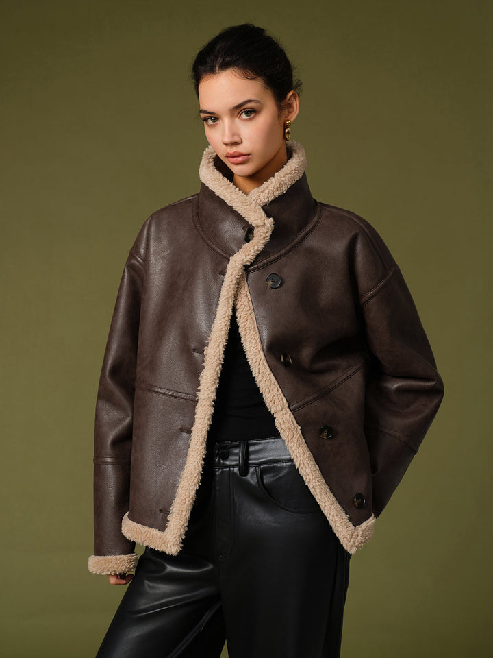 Side angle of the brown faux shearling jacket with the collar popped up for extra warmth
