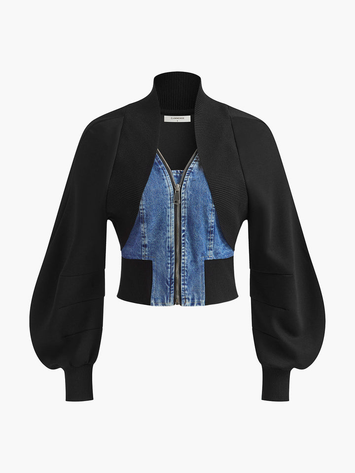 Front product shot of black puff sleeve crop jacket with blue denim panel insert and zip
