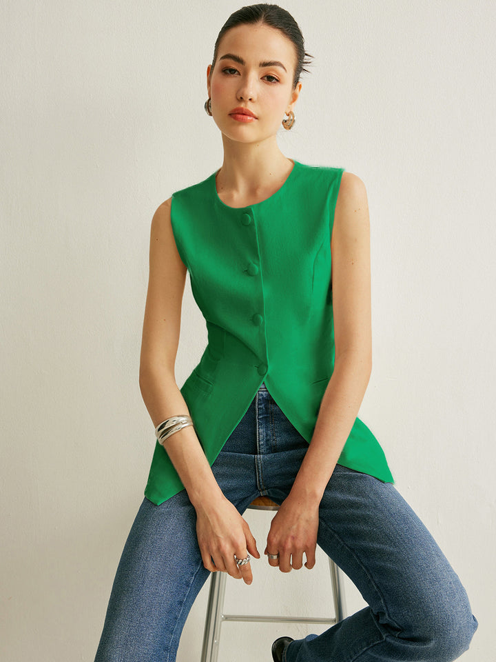 Bright green colourway of the button-detail sleeveless vest worn with blue jeans