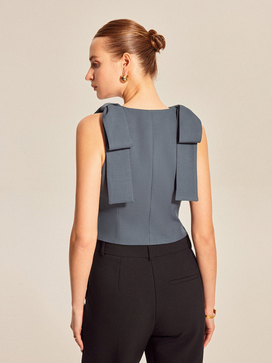 Back view of cropped bow shoulder waistcoat showing centre seam and bow tails