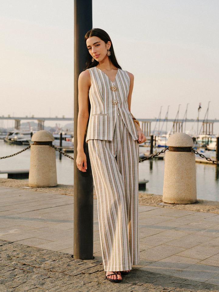 Full-length striped linen cotton vest set with black heeled sandals at sunset
