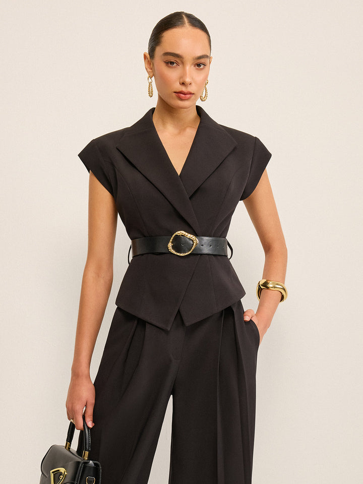 Front view of women's black belted peplum vest with notch lapels and cap shoulders