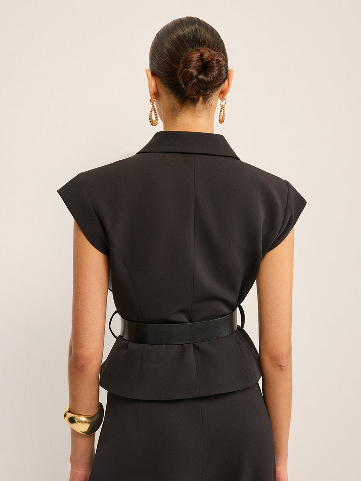 Back view of the black peplum vest with belt loops and flared back hem