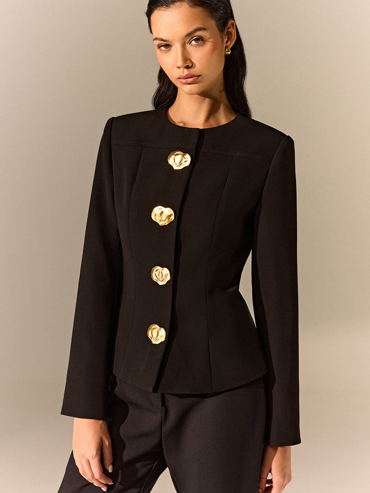 Front view of a black round neck blazer with a vertical row of molten gold buttons