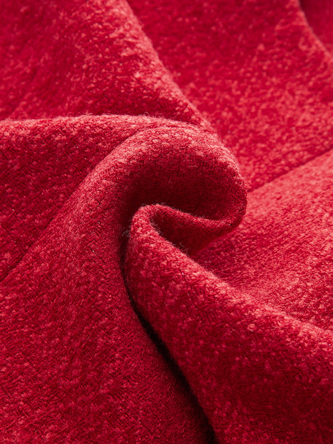 Macro gedrapeerde rode tweed stof met zachte melange textuur