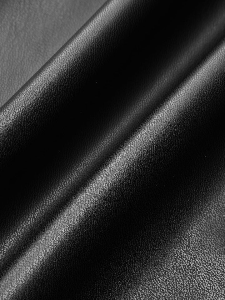 Macro of the soft matte black vegan leather used for this puff sleeve jacket