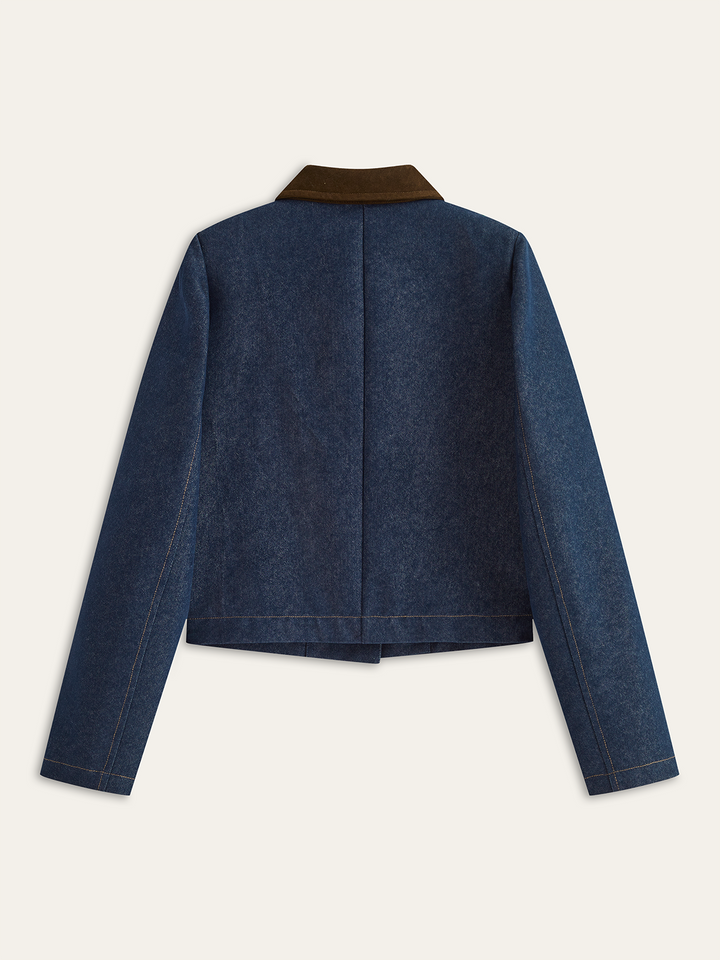 Back view of women's navy denim jacket with brown corduroy collar and boxy cropped fit