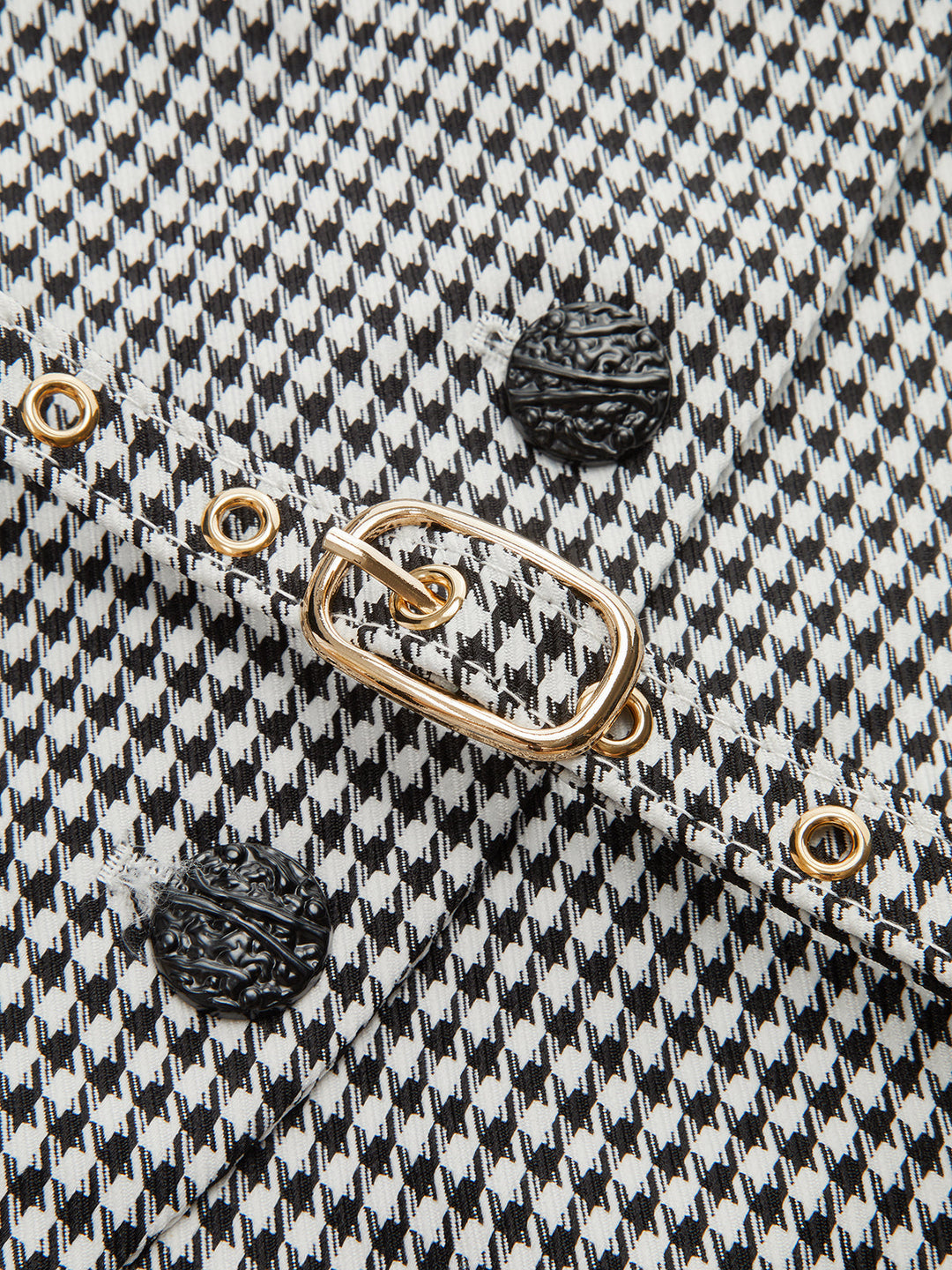 Macro of the black and white houndstooth check fabric used for this belted collar vest