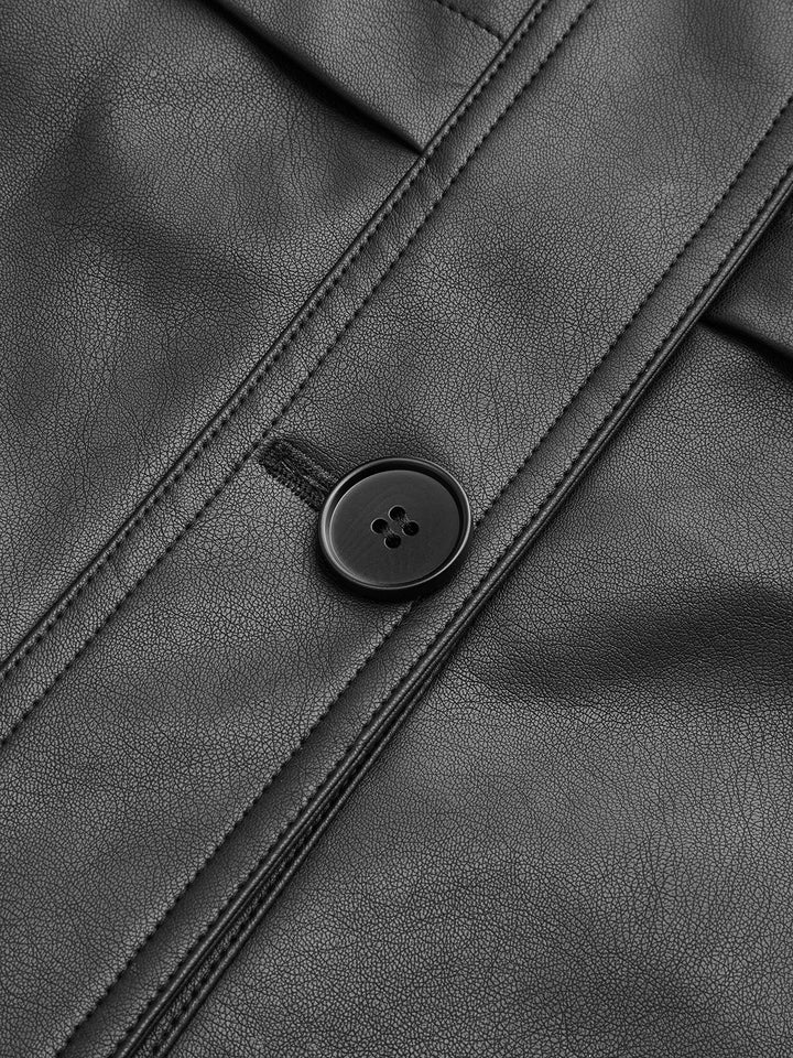 Close-up of matte black button and topstitched seam on a faux leather jacket