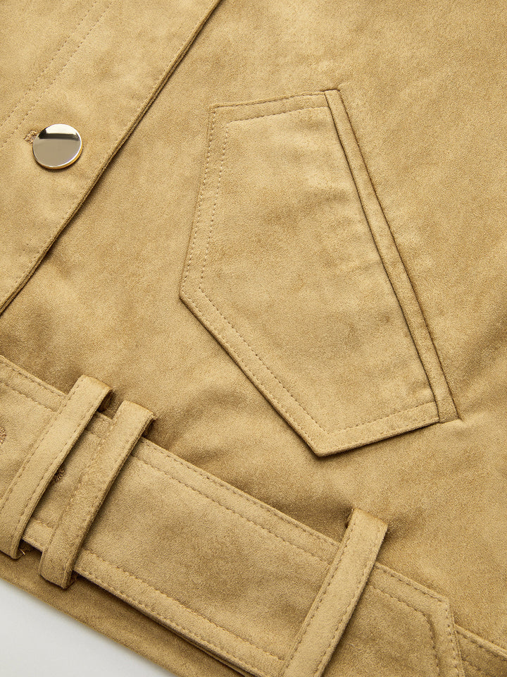 Detail of the angled flap pocket and belt loop on the tan suede jacket