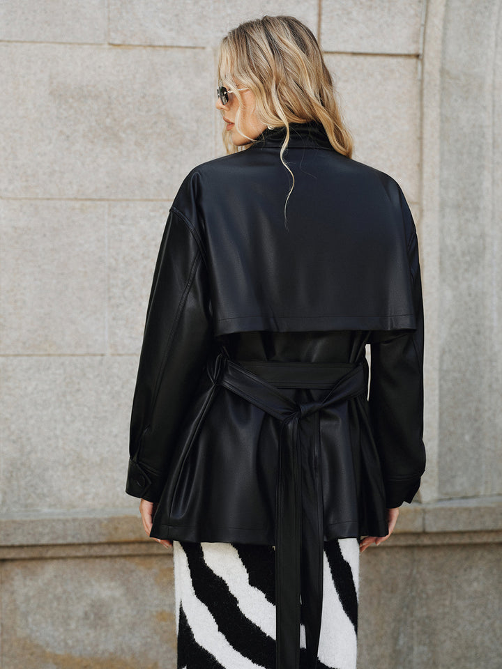 Back view of black PU leather jacket showing quilted yoke panel and bow-tied belt