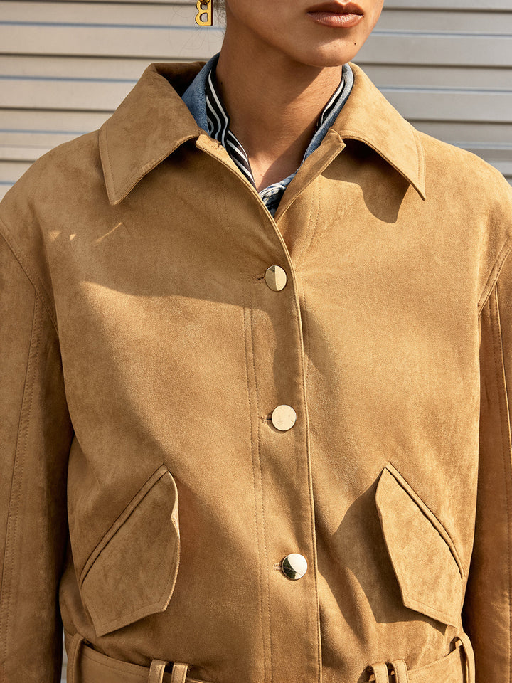 Close-up of the pointed collar and gold buttons on the khaki suede jacket