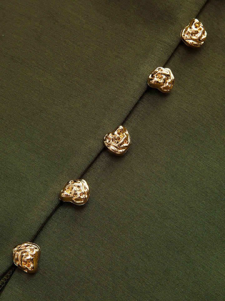 Close-up of textured gold nugget buttons on olive green women's cardigan placket
