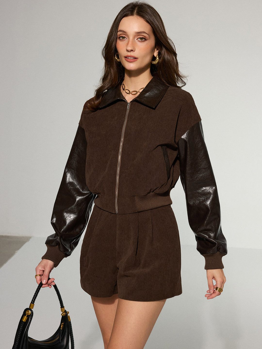Women's brown corduroy bomber jacket with leather look sleeves and ribbed hem