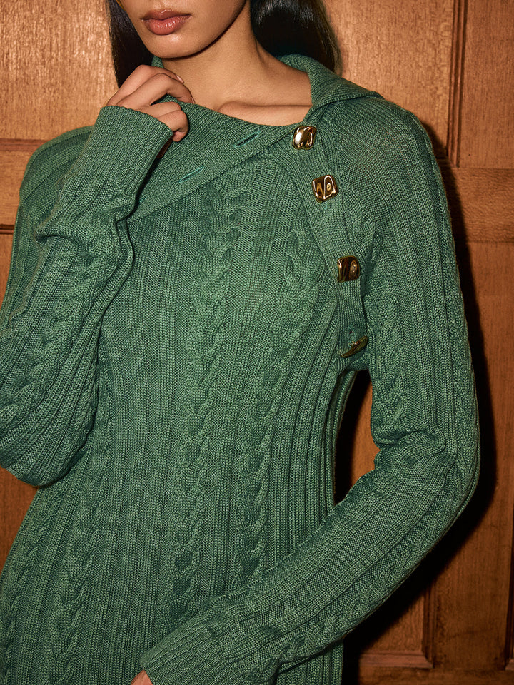 Close up of asymmetric collar with gold buttons on a sage green cable knit sweater dress