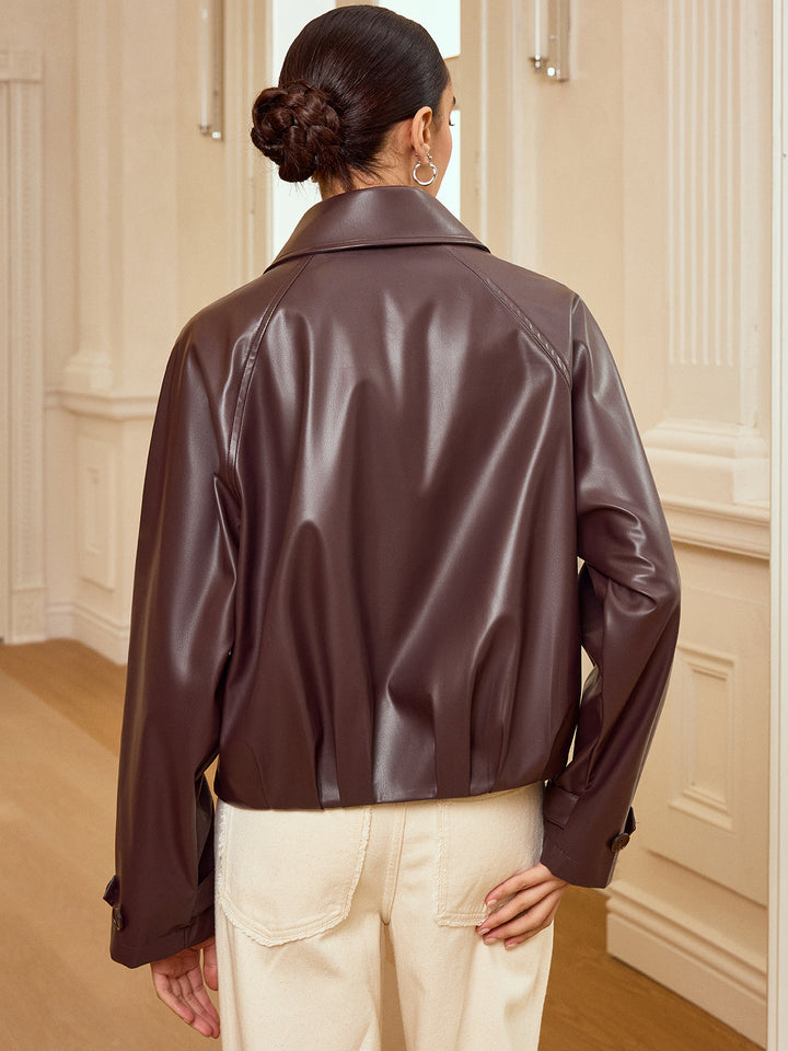 Back view of oversized brown PU leather zip jacket with raglan sleeve seams