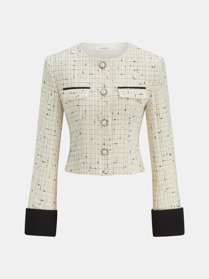Cream tweed cropped jacket for women with pearl buttons and contrasting black cuffs, front view