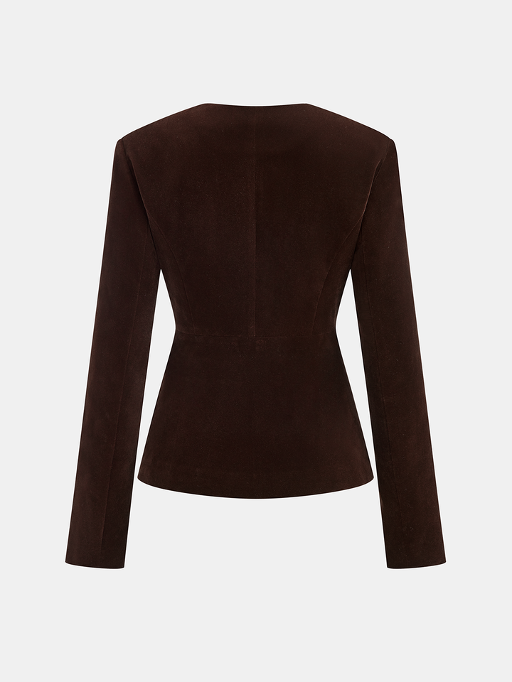 Back view of the brown velvet blazer showing the fitted waist and peplum hem