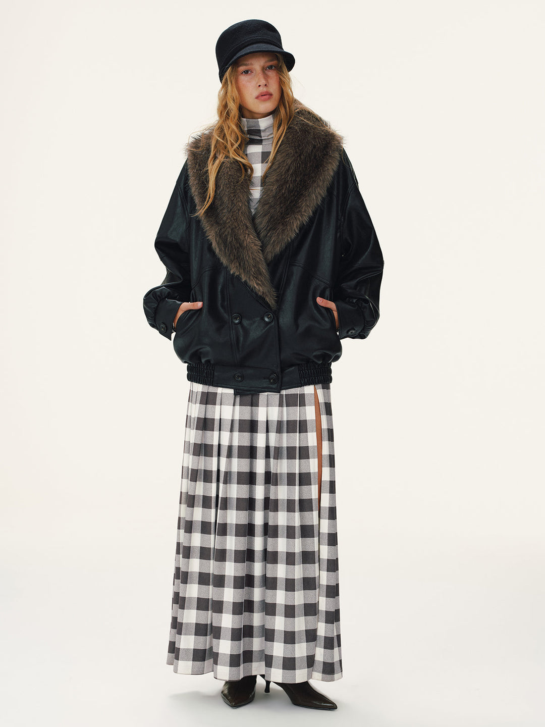Black faux leather bomber with detachable brown faux fur collar, full length look