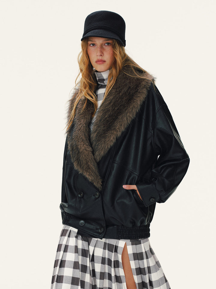 Side view of the black faux leather jacket with fur collar and slip pockets